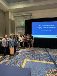 Monica Brooks - Monica posing with happy conference participants
